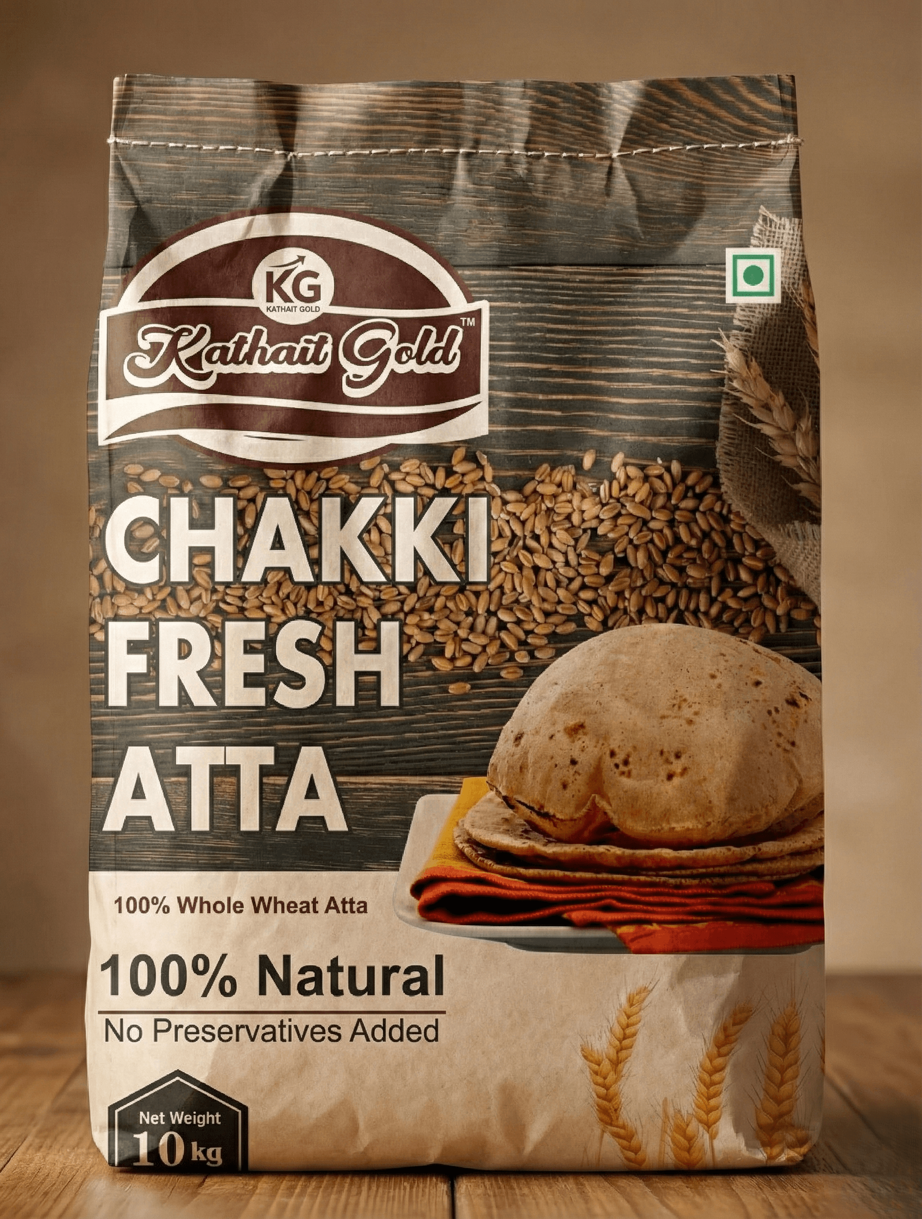 Kathait Gold Atta – 100% Pure Whole Wheat Flour for Soft, Fluffy Rotis 1 The Kathait Gold packaging standing upright with a small pile of golden wheat grains next to it.
